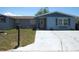 Inviting single-story home with well-maintained yard, walkway and covered entry at 3424 Truman Dr, Holiday, FL 34691