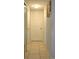 Neutral hallway with tiled floors and closet with standard doors at 3424 Truman Dr, Holiday, FL 34691