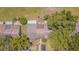 Overhead view showcasing backyard and mature trees surrounding the property at 35058 Whispering Oaks Blvd, Dade City, FL 33523