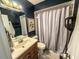 Functional bathroom with a vanity, toilet, and shower/tub combo, providing essential amenities at 35058 Whispering Oaks Blvd, Dade City, FL 33523