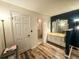 Bright bathroom featuring wood-look flooring, vanity and walk-in shower with glass doors at 35058 Whispering Oaks Blvd, Dade City, FL 33523