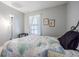 Cozy bedroom featuring hardwood flooring and a full sized window at 35058 Whispering Oaks Blvd, Dade City, FL 33523