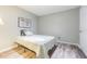 A cozy bedroom with luxury vinyl plank flooring and a soft comfortable bed at 35058 Whispering Oaks Blvd, Dade City, FL 33523