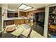 Well-equipped kitchen with wooden cabinets, stainless steel appliances, and a view into the living area at 35058 Whispering Oaks Blvd, Dade City, FL 33523