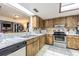 Kitchen view with stainless steel appliances and marble countertops at 35058 Whispering Oaks Blvd, Dade City, FL 33523