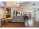 Open-concept living room featuring a fireplace, hardwood floors, and dining area at 35058 Whispering Oaks Blvd, Dade City, FL 33523