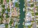 Aerial view of the waterfront property, showcasing the neighborhood and canal access at 3560 Beach Se Dr, St Petersburg, FL 33705