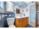 Stylish bathroom with blue tiling, a marble countertop, and ample storage at 3560 Beach Se Dr, St Petersburg, FL 33705
