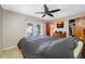 This bedroom has water views, a ceiling fan, closet, and access to the backyard at 3560 Beach Se Dr, St Petersburg, FL 33705