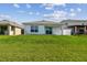Expansive backyard with a lush green lawn, offering plenty of space for outdoor enjoyment and entertaining at 36673 Spanish Rose Dr, Dade City, FL 33525