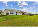 Picturesque backyard with lush green grass, ideal for outdoor activities and Gathering gatherings at 36673 Spanish Rose Dr, Dade City, FL 33525