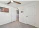 Bedroom featuring gray carpet and neutral walls with white trim and doors for privacy and function at 36673 Spanish Rose Dr, Dade City, FL 33525