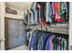 Walk-in closet features clothing racks, shelving, and a built-in dresser for optimal organization at 36673 Spanish Rose Dr, Dade City, FL 33525