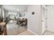 Open-concept dining area leading to a cozy living room and modern kitchen at 36673 Spanish Rose Dr, Dade City, FL 33525