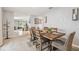Elegant dining room featuring a modern table set, stylish decor, and connecting to other living spaces at 36673 Spanish Rose Dr, Dade City, FL 33525