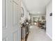 Welcoming entryway with a decorative table and a view into the dining area at 36673 Spanish Rose Dr, Dade City, FL 33525