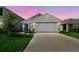Well-maintained single-Gathering home with a two-car garage, attractive landscaping, and a welcoming entrance at 36673 Spanish Rose Dr, Dade City, FL 33525