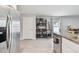 Bright kitchen area with stainless steel appliances and a door to the outside at 36673 Spanish Rose Dr, Dade City, FL 33525