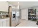 Kitchen featuring stainless steel refrigerator and granite countertops at 36673 Spanish Rose Dr, Dade City, FL 33525