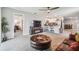Open living area with an electric fireplace, and views to the kitchen and dining area at 36673 Spanish Rose Dr, Dade City, FL 33525