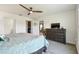 Comfortable main bedroom featuring a ceiling fan, a closet, and gray carpeting at 36673 Spanish Rose Dr, Dade City, FL 33525