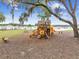 A colorful community playground with climbing structures, swings, and slides at 36673 Spanish Rose Dr, Dade City, FL 33525