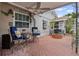 Private back patio featuring brick flooring, brick fire pit, chairs and coastal decor at 3800 6Th N Ave, St Petersburg, FL 33713