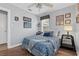 Bedroom with wood floors, coastal decor, and blue and white patterned bedding at 3800 6Th N Ave, St Petersburg, FL 33713