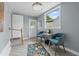 Inviting entry area featuring a seating area, a large window, and light gray walls at 3800 6Th N Ave, St Petersburg, FL 33713