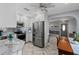 Bright kitchen showcasing white cabinetry, modern appliances, and herringbone floors with access to dining area at 3800 6Th N Ave, St Petersburg, FL 33713