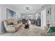 Comfortable living room with herringbone floors, neutral furniture, and stylish decor at 3800 6Th N Ave, St Petersburg, FL 33713