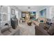 Spacious living room with herringbone floors, stone fireplace, and comfortable seating at 3800 6Th N Ave, St Petersburg, FL 33713