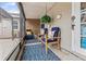 Relaxing screened patio with comfortable seating, fern, and access to the home at 3800 6Th N Ave, St Petersburg, FL 33713