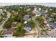 Gorgeous aerial showcasing the water, greenery, and a house with stunning curb appeal at 493 Lucerne Ave, Tampa, FL 33606