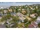 Aerial view of homes near the water featuring lush greenery and views of the bay at 493 Lucerne Ave, Tampa, FL 33606