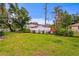 Well-maintained backyard featuring a lush green lawn and a white picket fence at 493 Lucerne Ave, Tampa, FL 33606