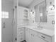Bathroom featuring white vanity, drawers, open shelving, quartz counters, shower and modern hardware at 493 Lucerne Ave, Tampa, FL 33606