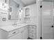 Bathroom featuring custom vanity with drawers, open shelving and modern hardware at 493 Lucerne Ave, Tampa, FL 33606