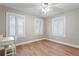 Bedroom with hardwood floors, ceiling fan, plantation shutters and natural light at 493 Lucerne Ave, Tampa, FL 33606