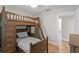 Charming bedroom featuring a unique wooden bunk bed and hardwood floors at 493 Lucerne Ave, Tampa, FL 33606