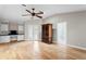 Spacious bedroom with hardwood floors, ceiling fan, built in shelving, French doors and bathroom access at 493 Lucerne Ave, Tampa, FL 33606