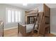 Bedroom featuring wood bunk bed with ladder, built in drawers and desk space at 493 Lucerne Ave, Tampa, FL 33606