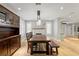 Open dining area with hardwood floors, pendant lighting, and fireplace at 493 Lucerne Ave, Tampa, FL 33606