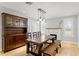 Open dining area with hardwood floors, pendant lighting, and fireplace at 493 Lucerne Ave, Tampa, FL 33606