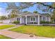 Well-maintained single-story home with manicured front lawn and gray exterior at 493 Lucerne Ave, Tampa, FL 33606