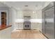 Gourmet kitchen featuring custom cabinetry and stainless steel appliances at 493 Lucerne Ave, Tampa, FL 33606