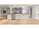Stylish kitchen island with white cabinetry and stainless steel appliances at 493 Lucerne Ave, Tampa, FL 33606