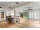 Open living area featuring hardwood floors, large kitchen island, and neutral paint scheme at 493 Lucerne Ave, Tampa, FL 33606