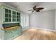 Sitting room featuring hardwood floors, plantation shutters, and traditional hutch at 493 Lucerne Ave, Tampa, FL 33606