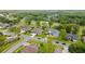 An aerial view showing several homes in a lush neighborhood at 5182 Championship Cup Ln, Spring Hill, FL 34609